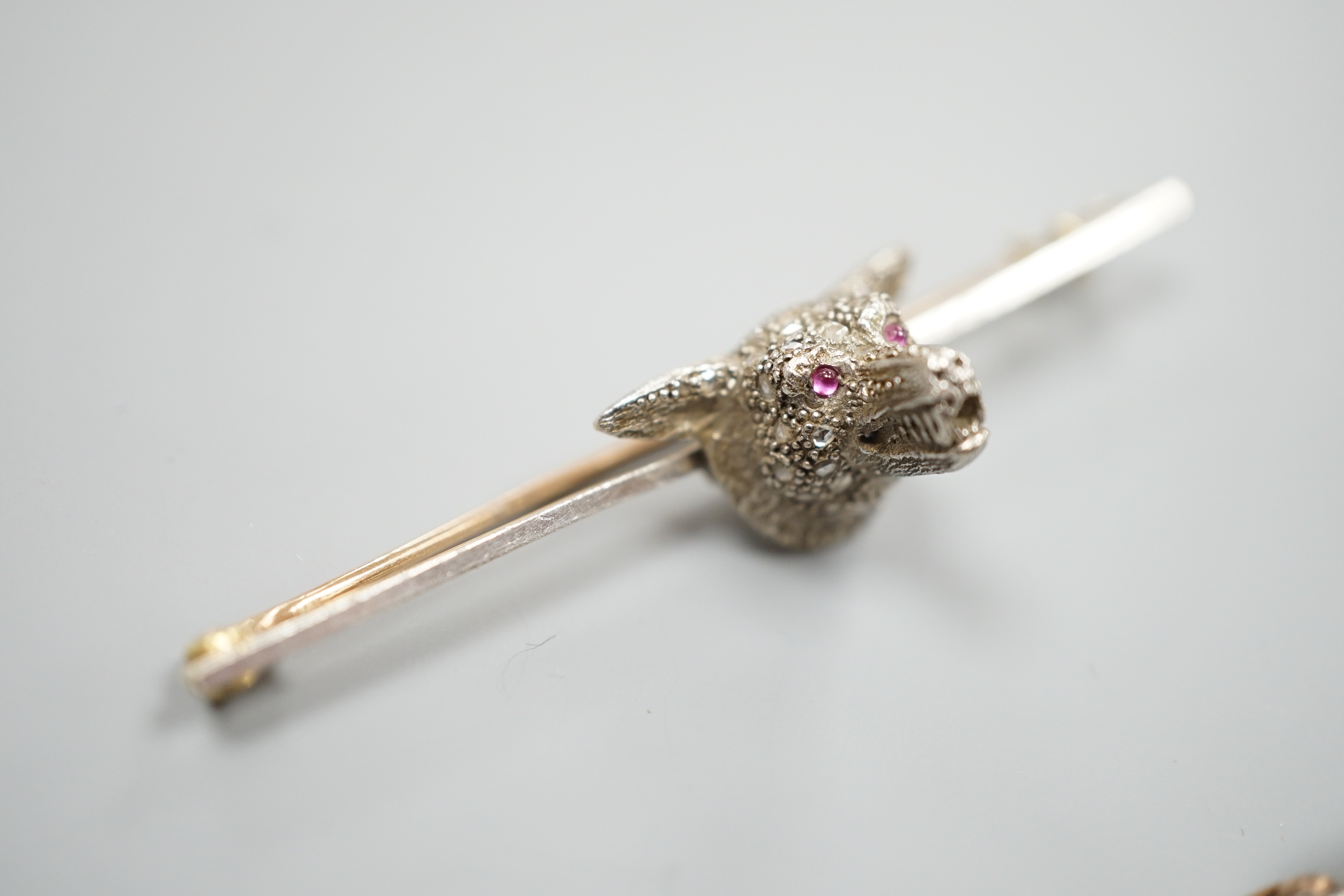 A yellow and white metal, rose cut diamond set fox head bar brooch, 62mm and a yellow metal, rose cut diamond and turquoise set bar brooch, gross weight 11.6 grams.